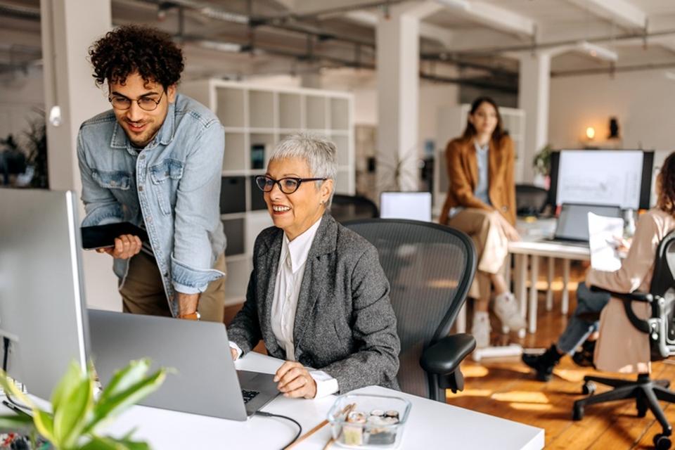 Colleagues working together in the modern office