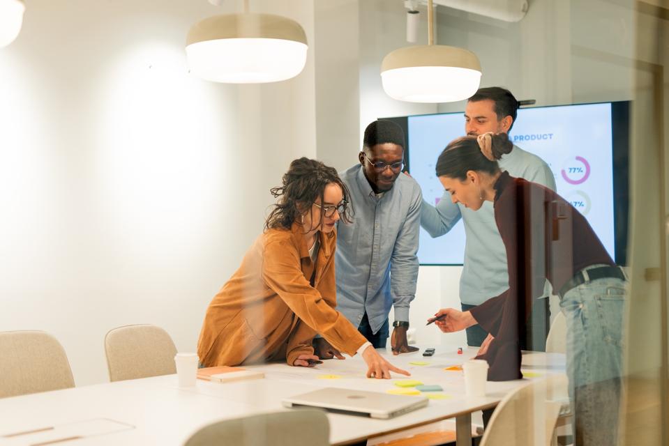 Marketing team analyzing data and planning new strategy