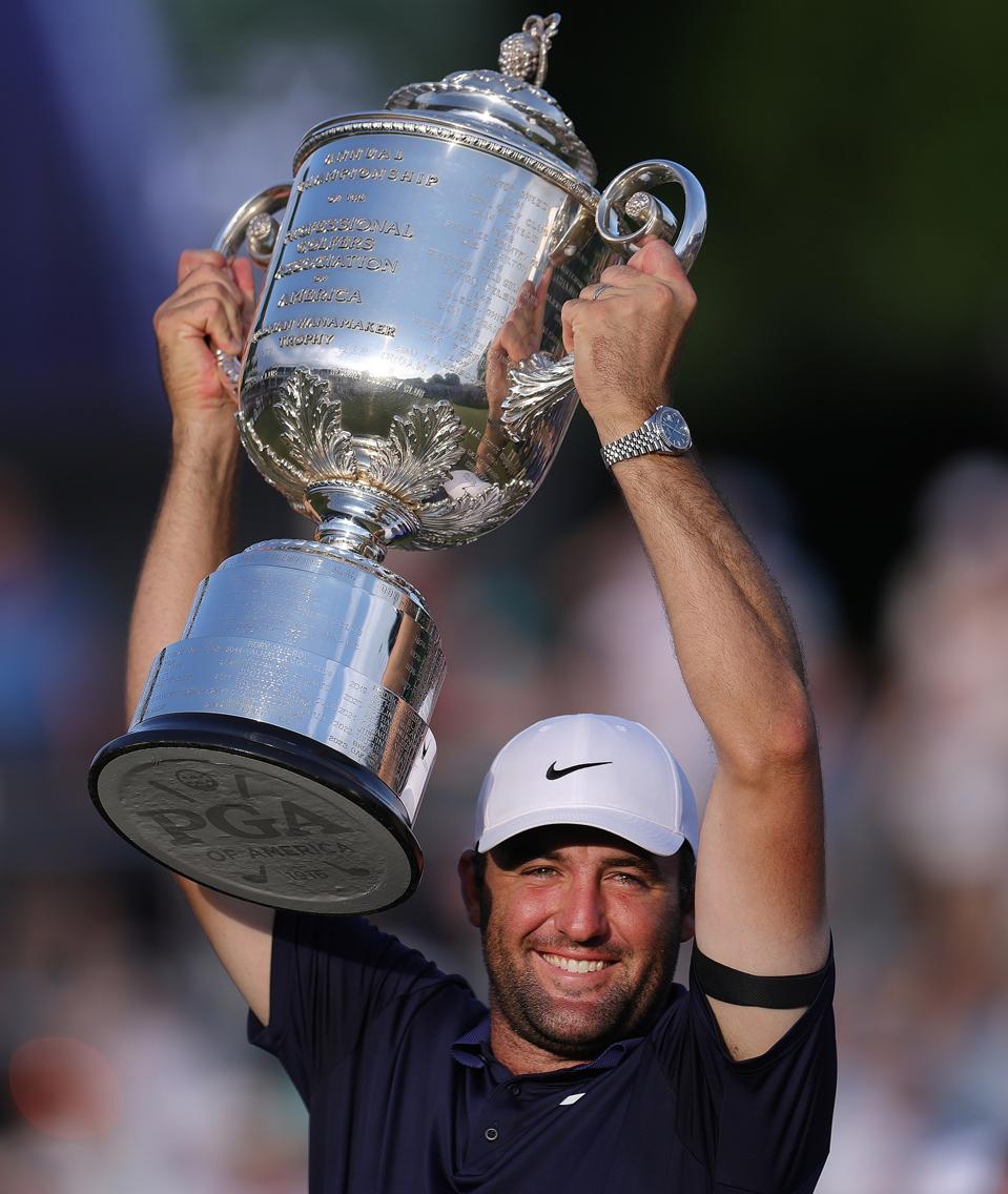 PGA Tour golfer Scottie Scheffler with the PGA Championship trophy.