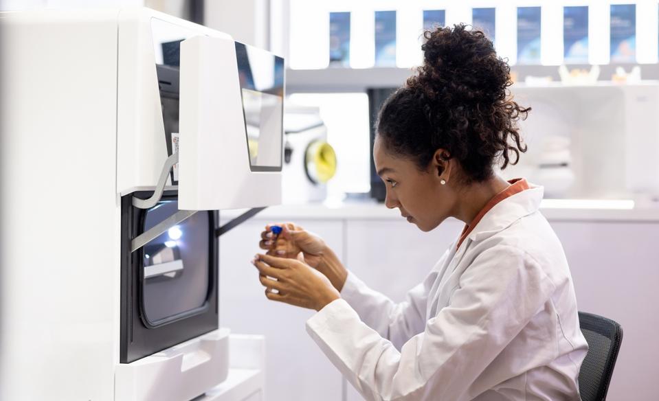 Health engineer bioprinting models at a 3D laboratory