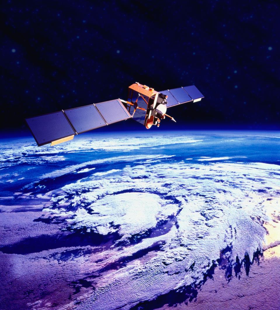 Communications satellite orbiting Earth (digital composite)