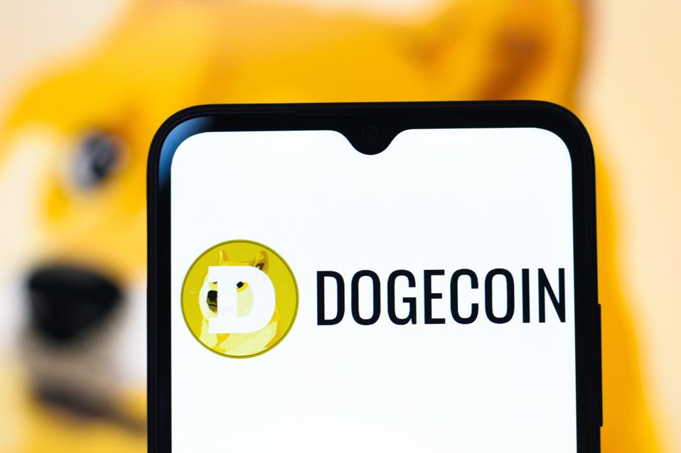 In this photo illustration, the Dogecoin logo is seen...