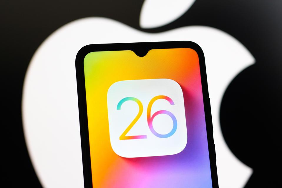 In this photo illustration, the Apple iOS 26 logo is seen...