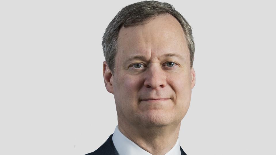Headshot of David Wyshner on an off-white background
