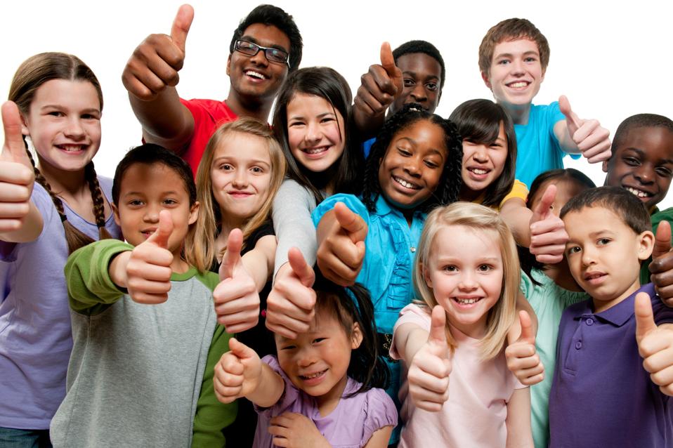 Kids K through 12th grade giving thumbs up