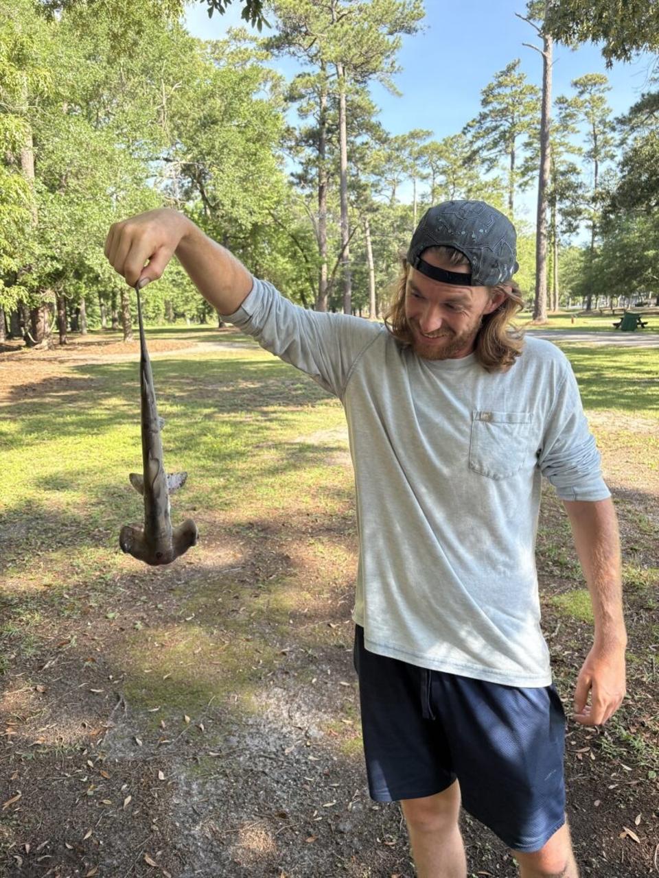 Jonathan Marlowe holding the dropped shark.
