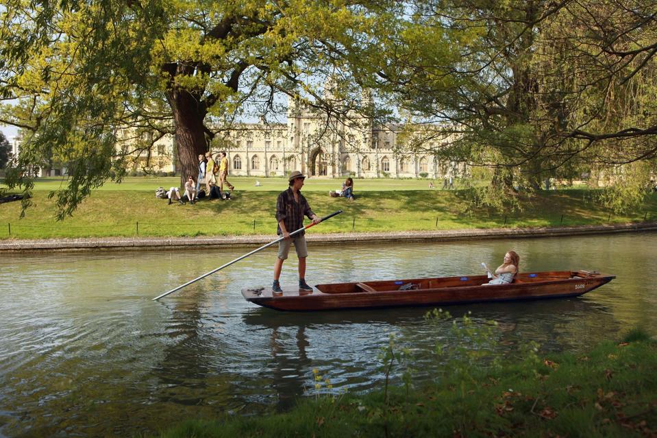 A picture of someone punting in Cambridge