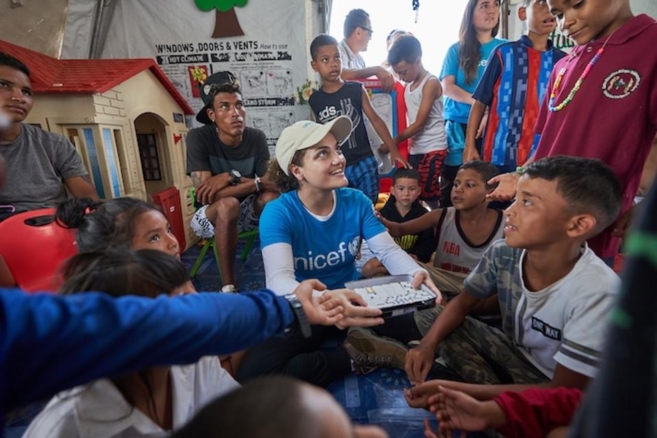 UNICEF Ambassador Laurie Hernandez with UNICEF-supported children in Panama.