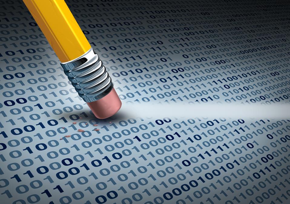 Binary code is wiped away by a pencil eraser.