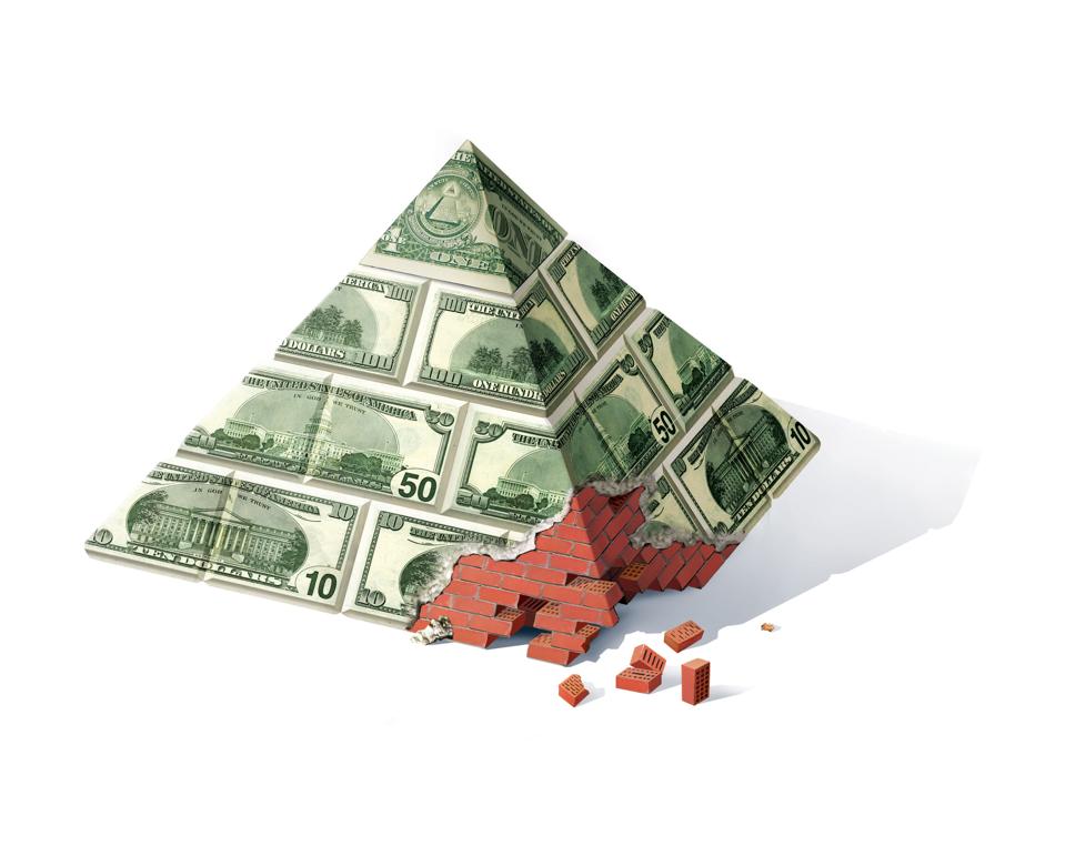 Banking pyramids. A crisis. A pyramid of red brick with a native destroyed corner.