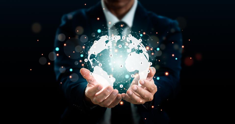 A businessman is holding Connection to the global network. Big data analytics and business intelligence.Global business point and line composition concept on a world map.Digital connection technology.