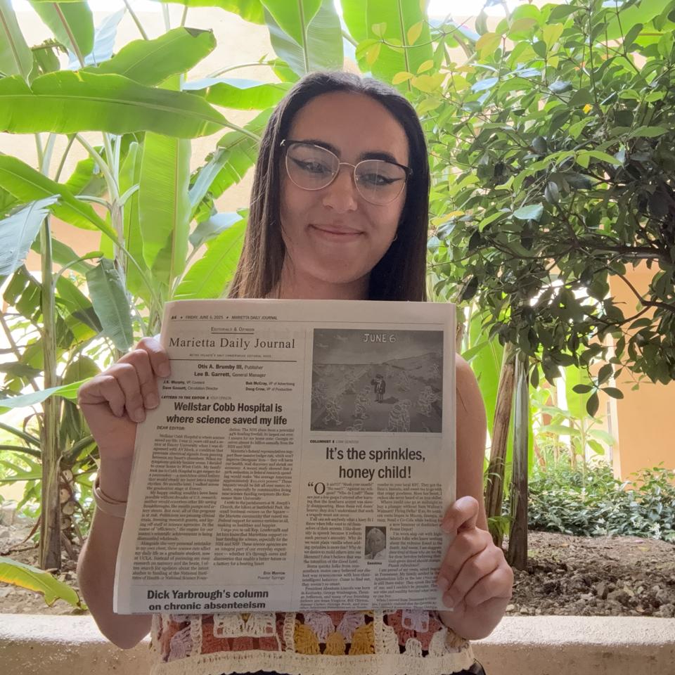 Erin Morrow and newspaper