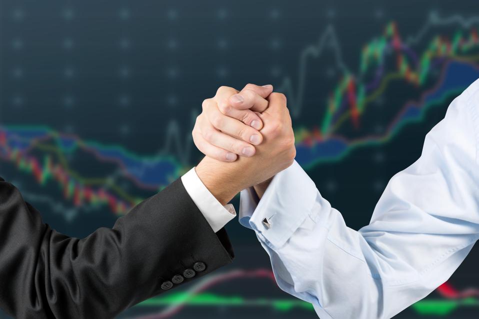 hands engaged in arm wrestling