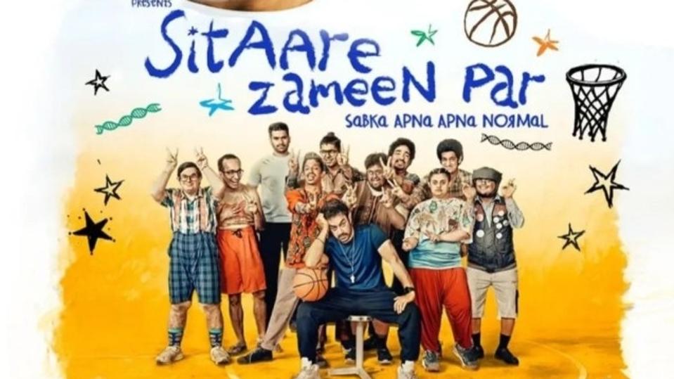 Indian star Aamir Khan poses with the cast of his new Hindi film 'Sitaare Zameen Par' on a poster of the film.
