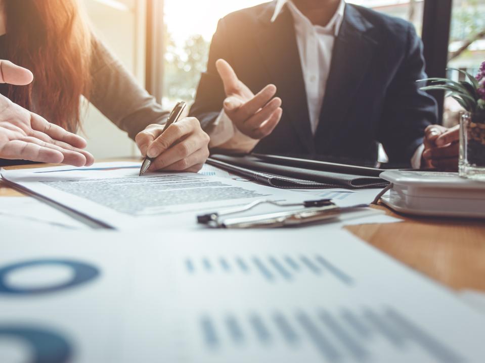 Business investors meeting and signing documents