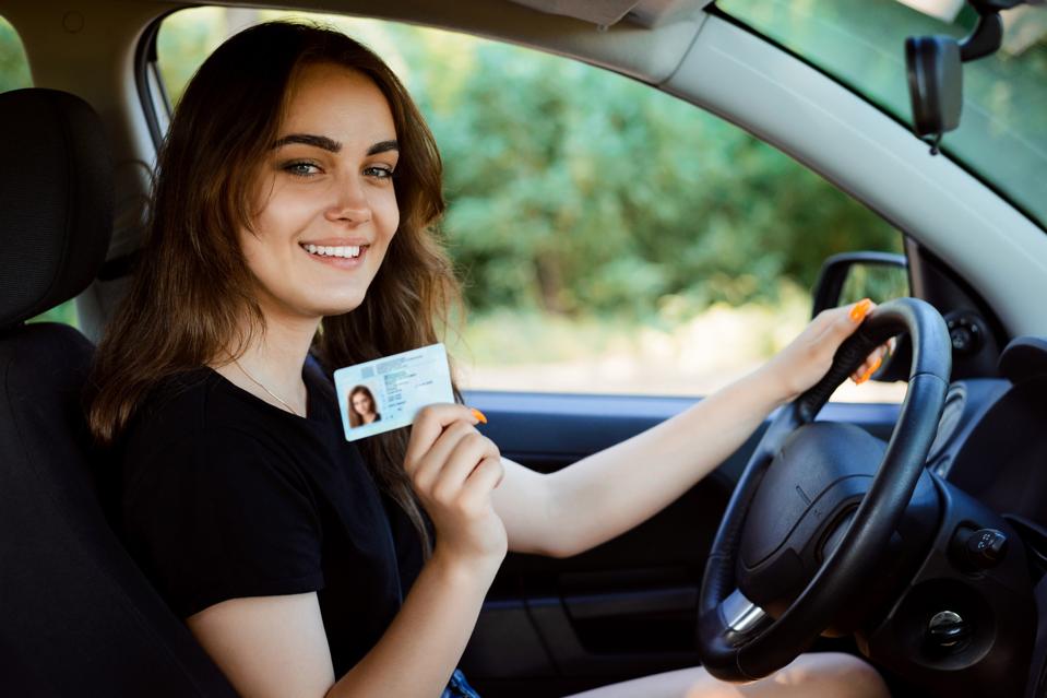 Student showing her driver's license