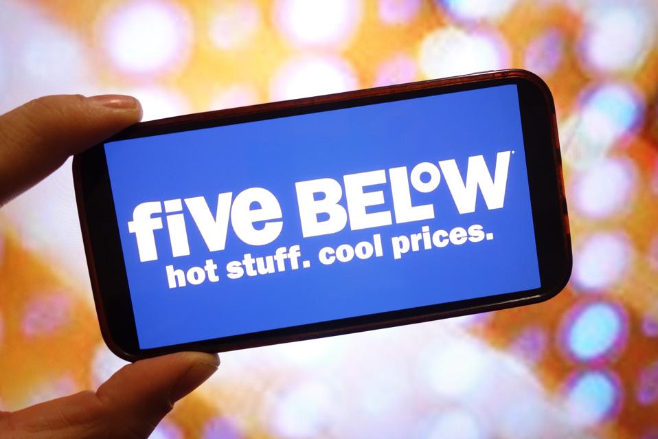 In this photo illustration, the Five Below company logo is...