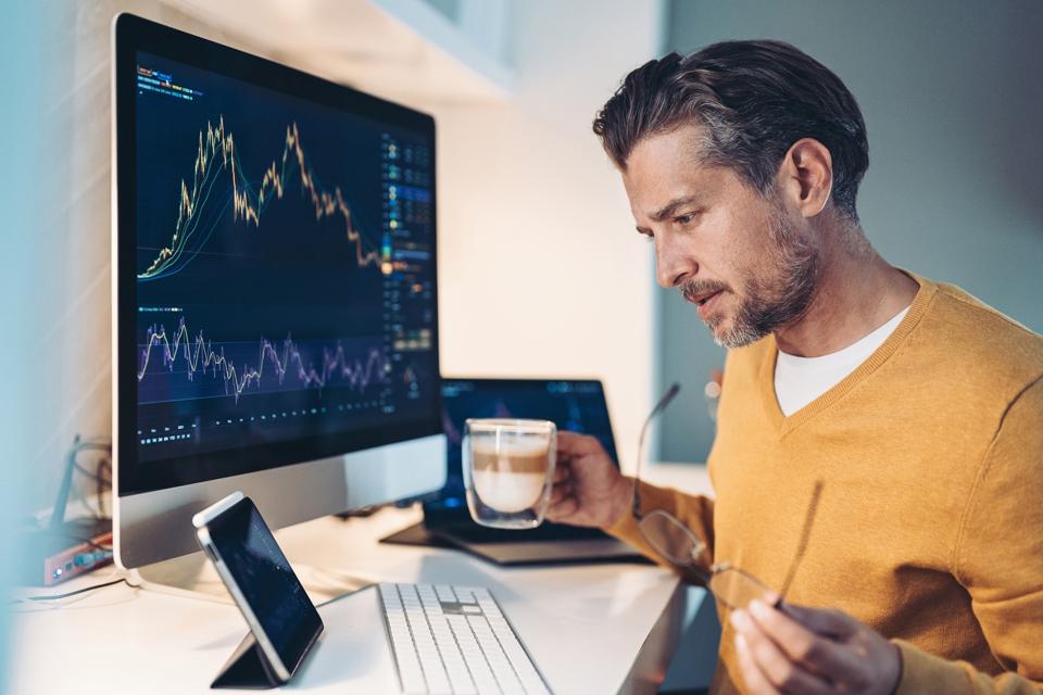 Mid adult man looking at financial data