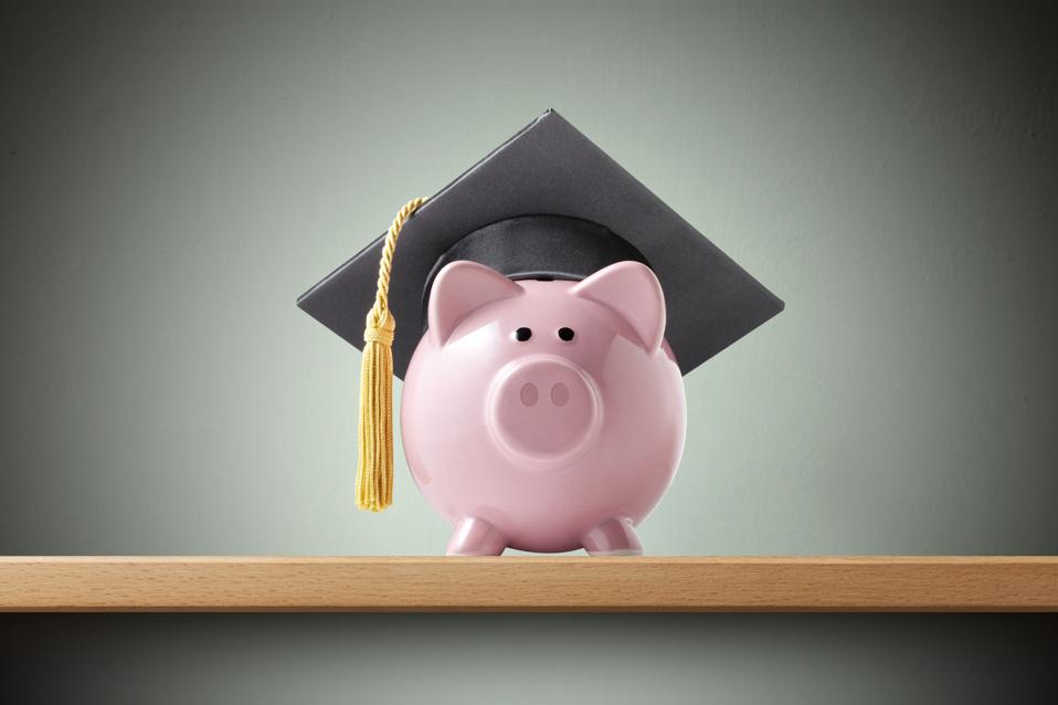 A piggy bank wearing a graduation cap symbolizes the importance of choosing a college degree with a strong return on investment.