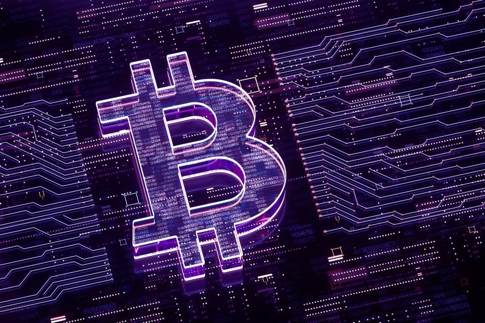 An image including a logo of cryptocurrency bitcoin and what look like circuits on a circuit board.