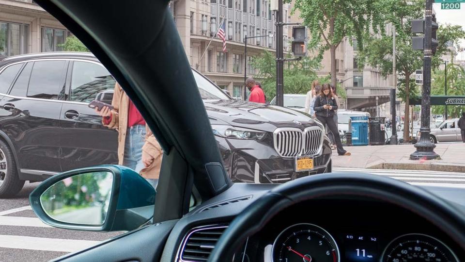 A photo looking out the dashboard that shows a blind zones.