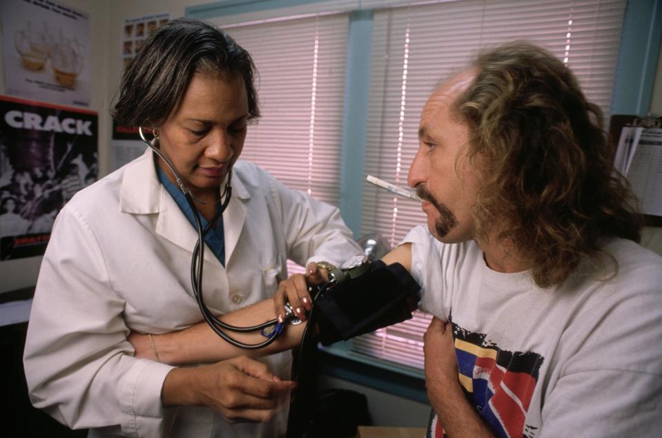 Man Receiving Physical at Clinic