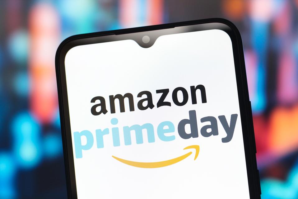 In this photo illustration, the Amazon Prime Day logo is...