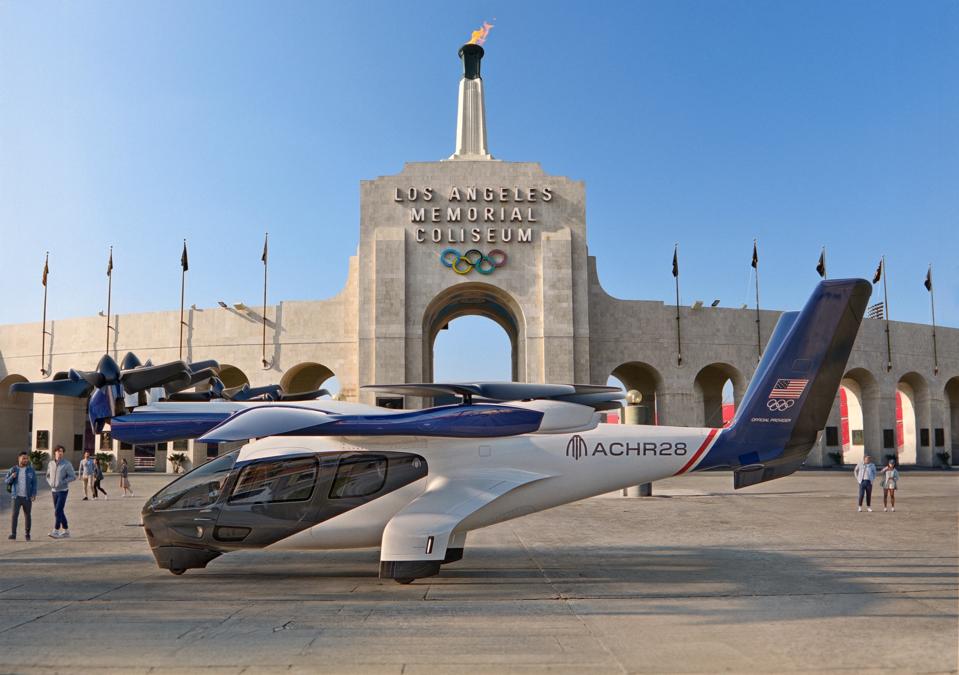 Archer aircraft in front of Los Angeles Memorial Colisium, a key Summer Olympics venue.