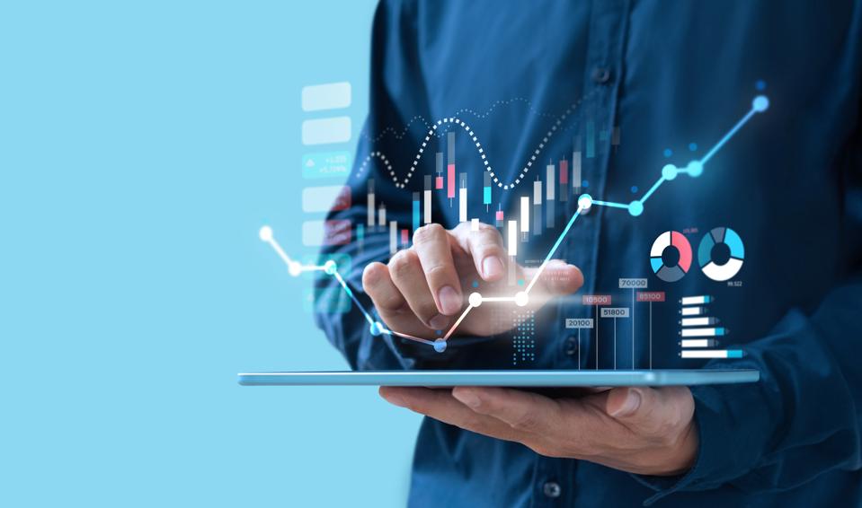 Businessman trading online stock market on teblet screen, digital investment concept.