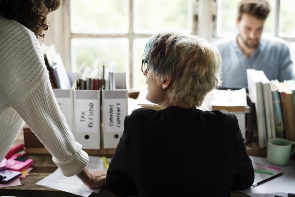 Colleagues Exchanging Opinion Ideas Working