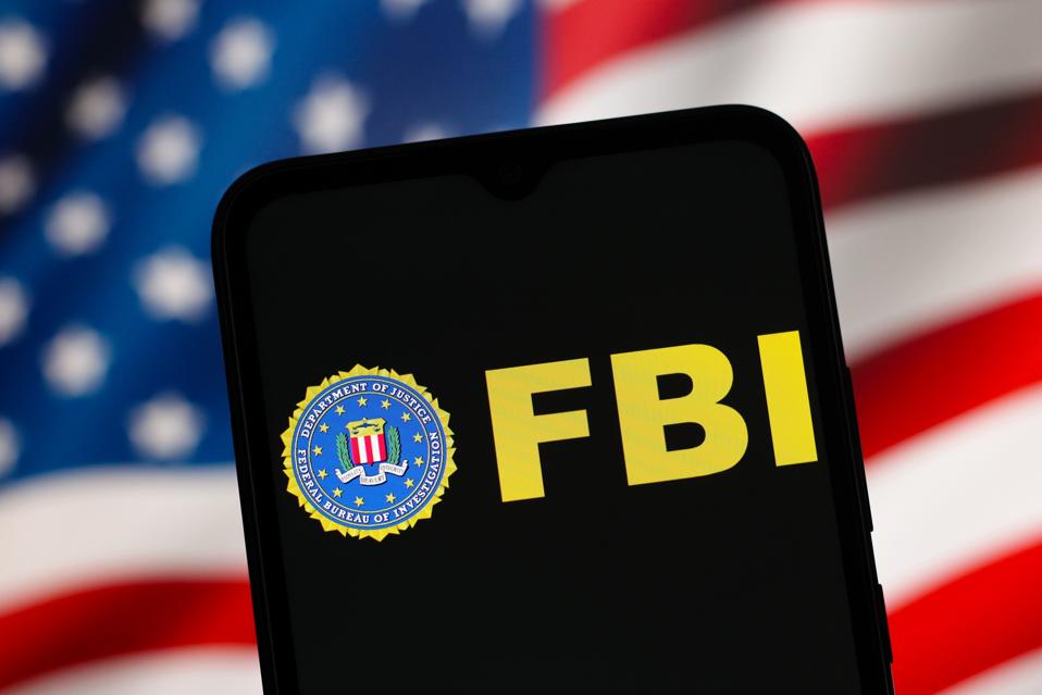 Federal Bureau of Investigation (FBI) logo is seen displayed on a smartphone screen.