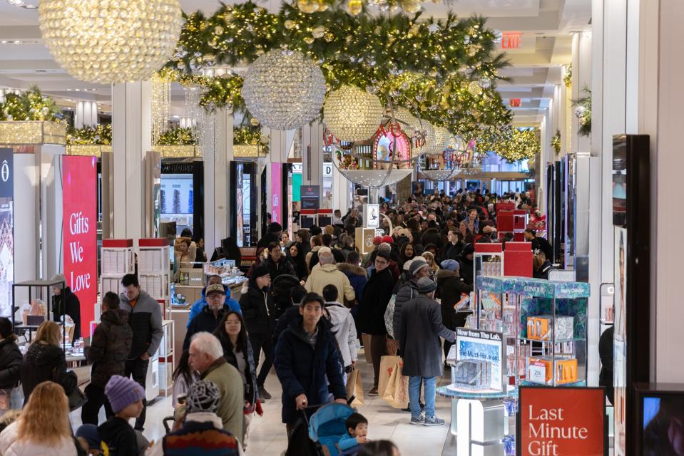 Shoppers walk around Macy's