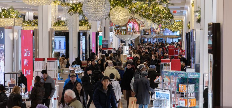 Shoppers walk around Macy's