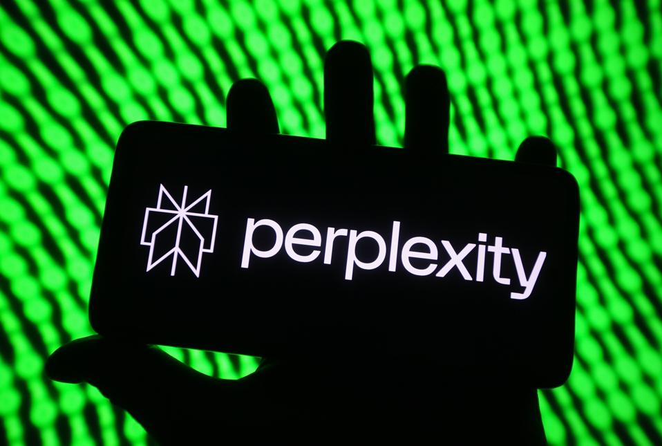 In this photo illustration, Perplexity AI logo is seen on a...
