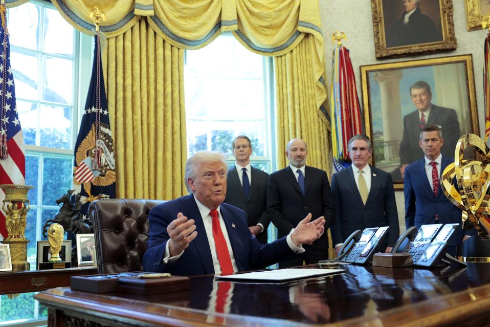 President Donald Trump speaks in Oval Office with members of Cabinet
