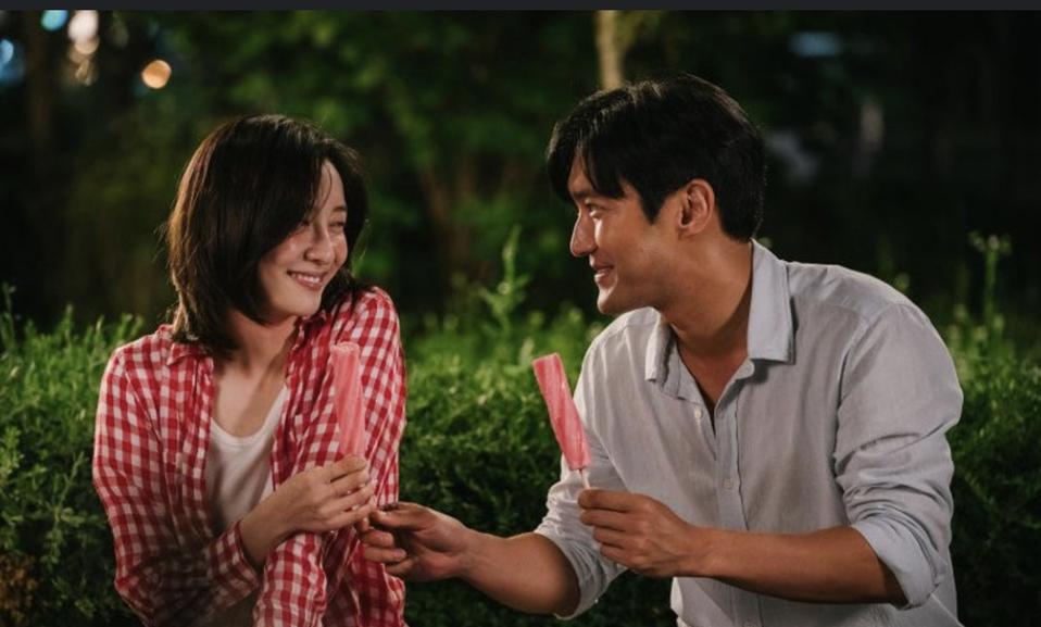 A man and a woman sample ice pops.