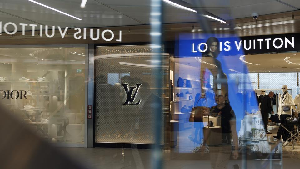 Dior and Louis Vuitton storefronts at Milan Malpensa Airport