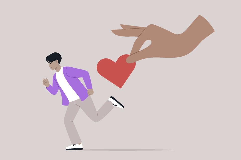 A figure dashes away from an outstretched hand offering a heart, symbolizing the struggle of avoidant attachment in personal relationships and the fear of intimacy