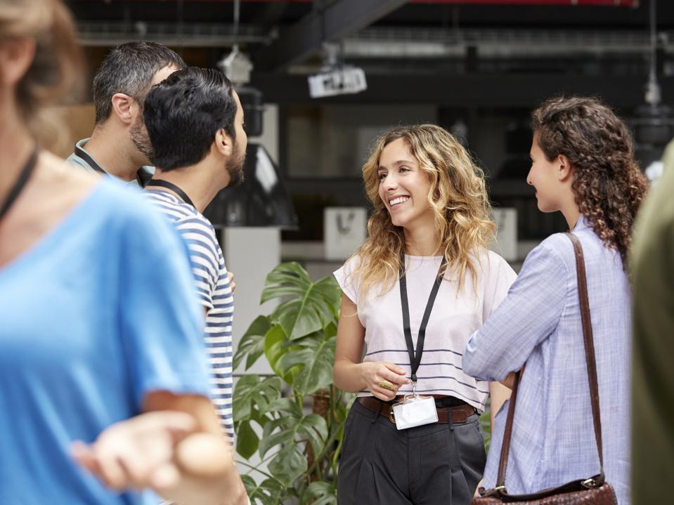 Smiling business team standing during meeting