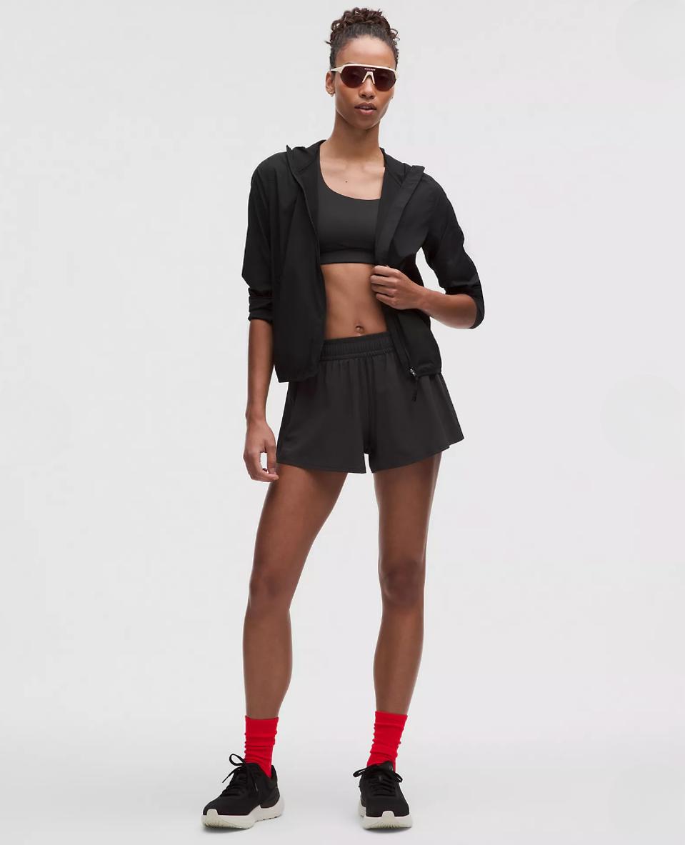 Model wearing Lululemon Pace Crush High-Rise Short in Black.