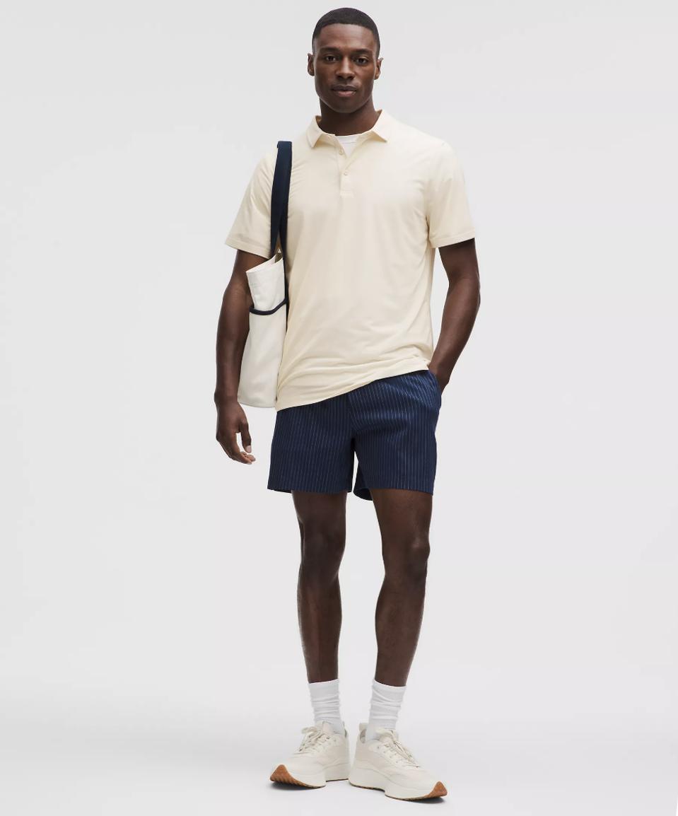 Model wearing Lululemon Evolution Short-Sleeve Polo Shirt.