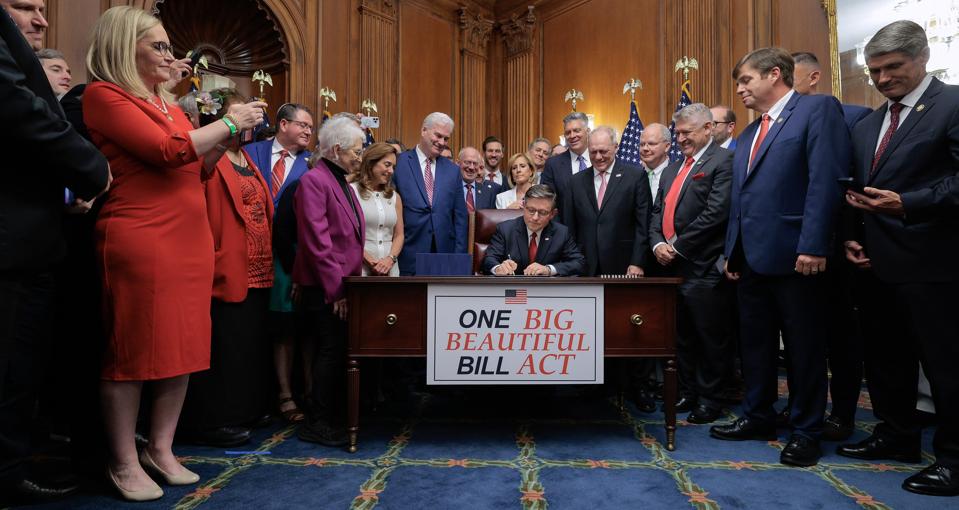 House Speaker Mike Johnson signs the One Big Beautiful Bill Act on July 3 in Washington DC