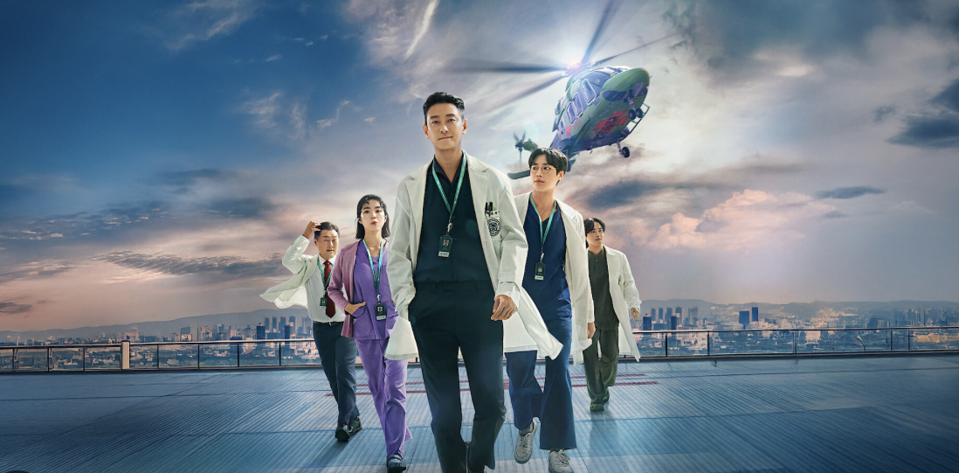 A group of doctors walk away from a helicopter.