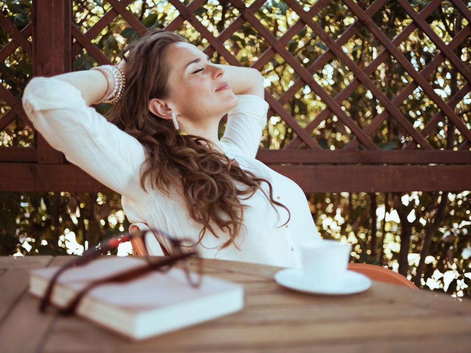 A shopper relaxes with a coffee and a book