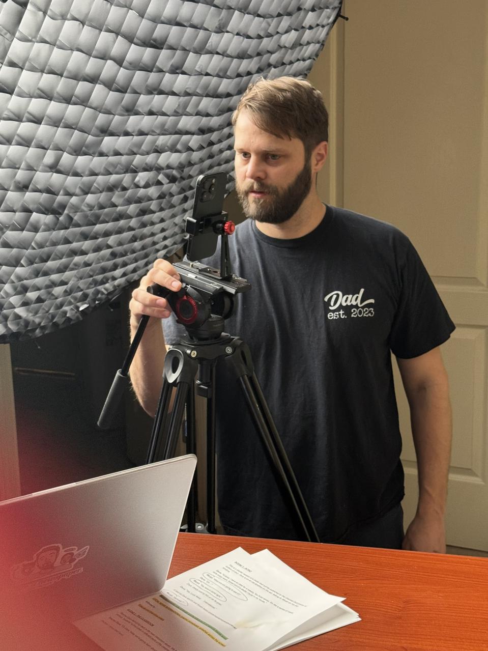 Dave Jorgenson adjusts a camera setting