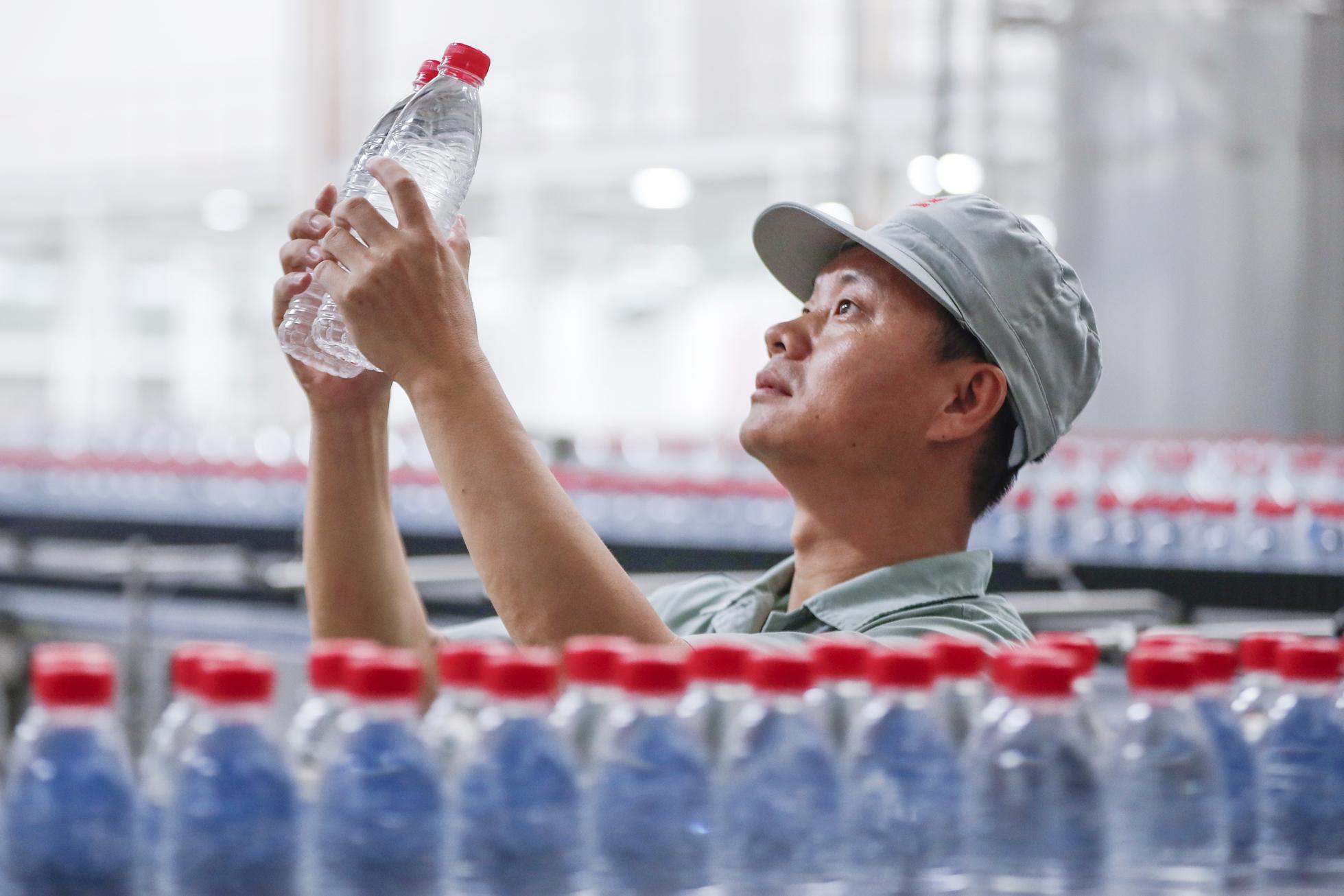 Employees Busy At Work In Nongfu Spring's Huangshan Plant