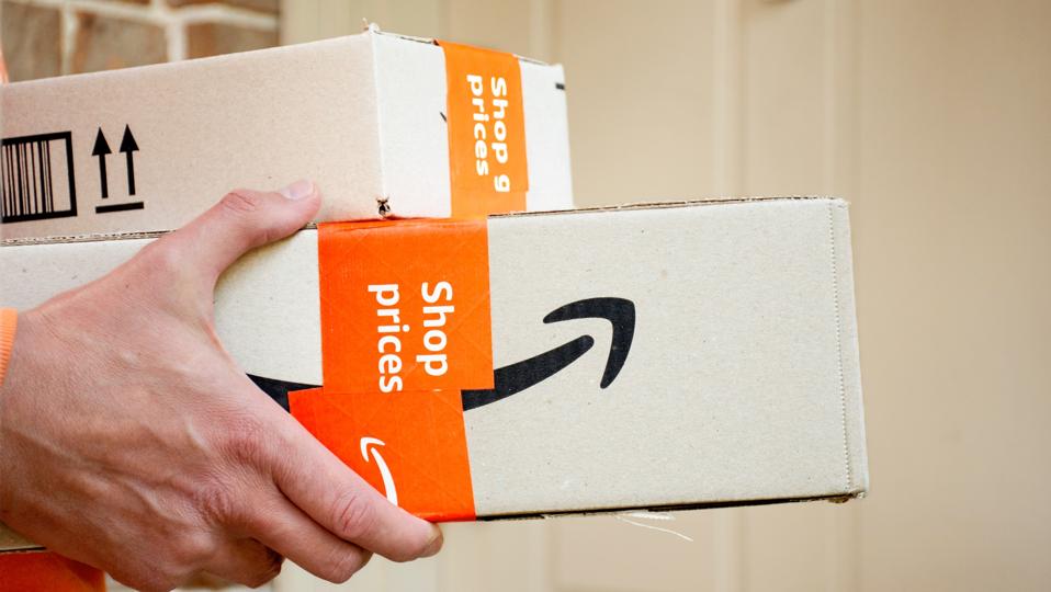 Amazon prime boxes delivered to a front door of residential building.