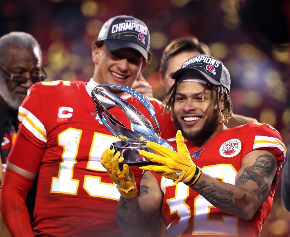 Tyrann Mathieu celebrates with Patrick Mahomes.
