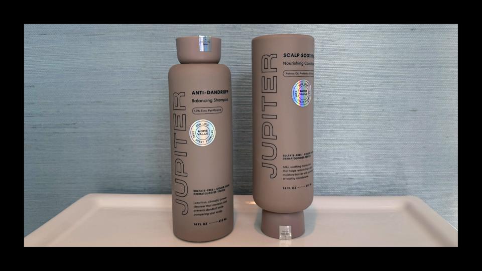 Jupiter Balancing Shampoo and Nourishing Conditioner with a blue background