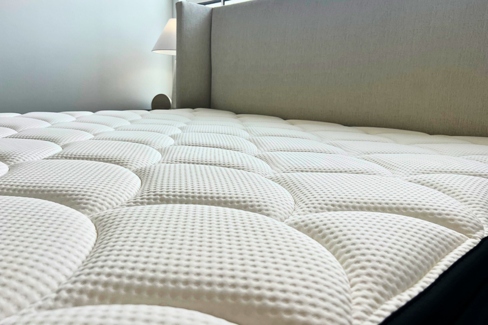 original photo of dreamcloud luxe hybrid queen close-up on pillowtop